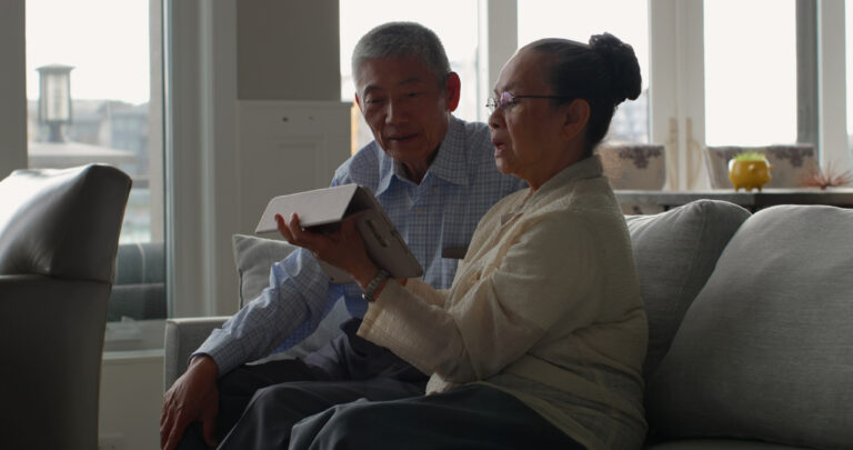 Retiree reviewing retirement account statement with RMD highlighted in bold”