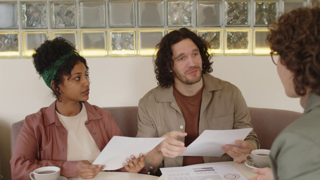 High net worth couple asking questions to fee-only financial planner